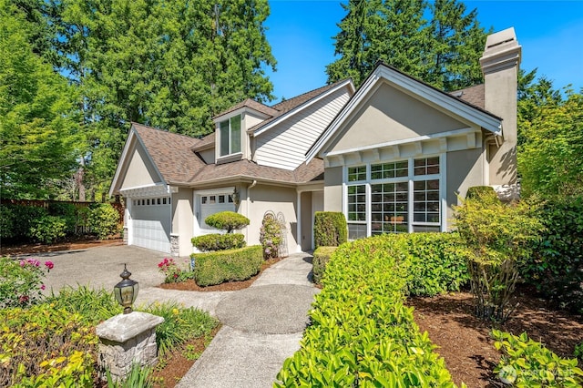 16639 Northup Way, Bellevue, WA 98008 - view of front of property with stucco siding, an attached garage, driveway, a shingled roof, and a chimney