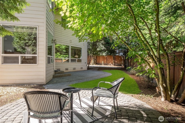 16639 Northup Way, Bellevue, WA 98008 - fenced backyard featuring a patio area