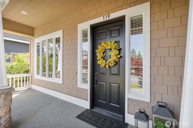 property entrance featuring a porch