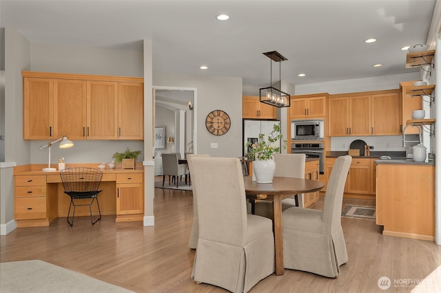 dining space featuring recessed lighting and light wood-style flooring