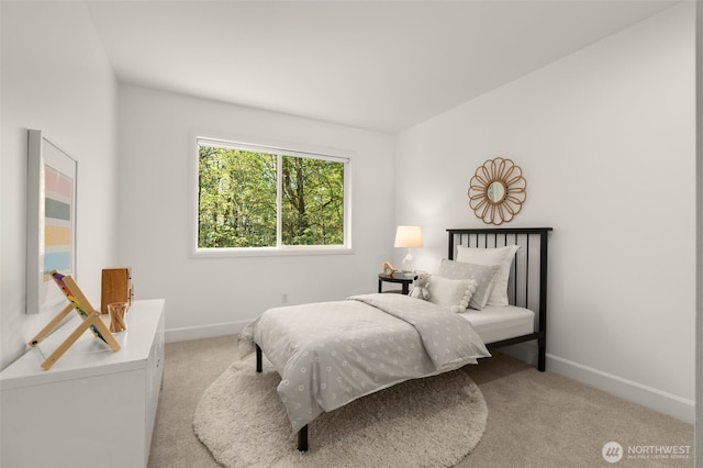 carpeted bedroom featuring baseboards