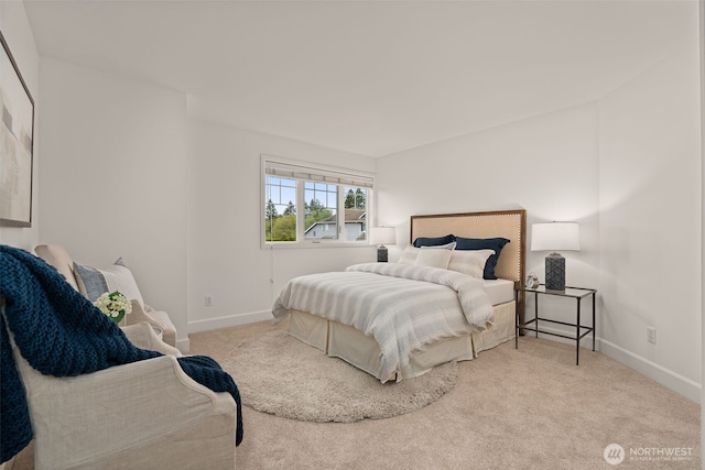 bedroom with carpet floors and baseboards