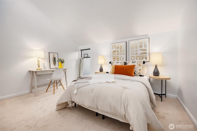 bedroom featuring carpet, vaulted ceiling, and baseboards