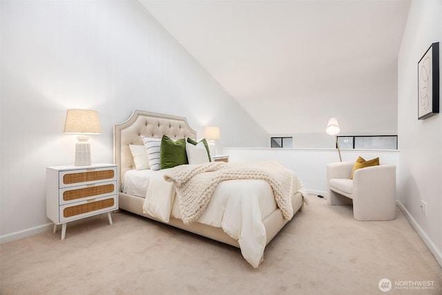 bedroom with carpet floors, lofted ceiling, and baseboards