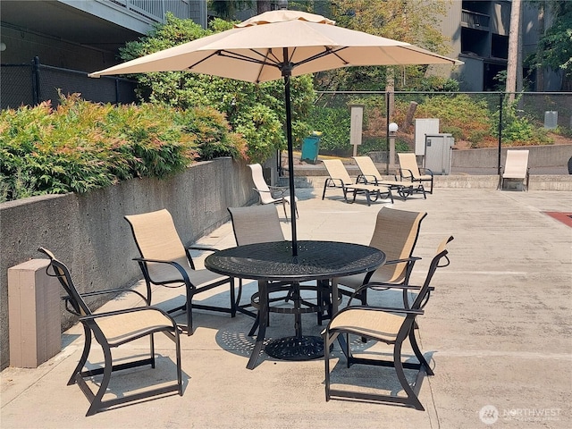 view of patio / terrace featuring fence
