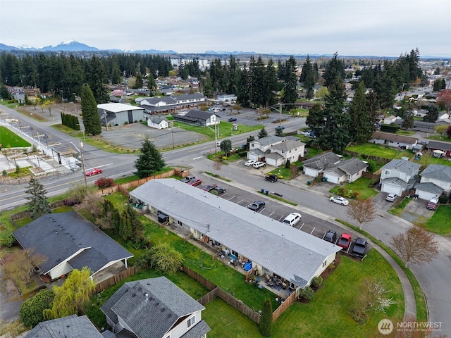 birds eye view of property featuring a mountain view and a residential view