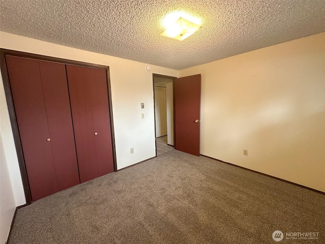 unfurnished bedroom with a textured ceiling, a closet, and light carpet