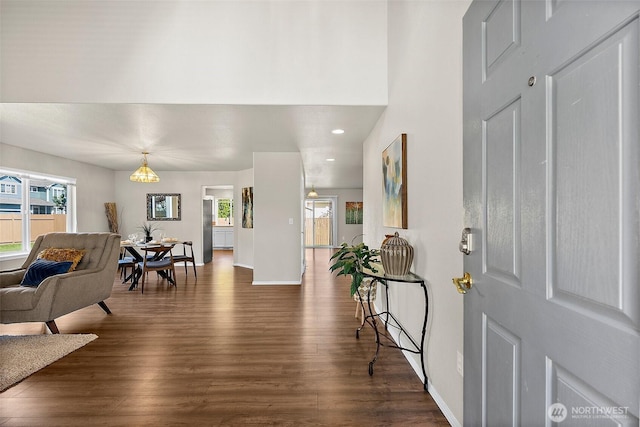 entryway featuring recessed lighting, baseboards, and dark wood-style flooring