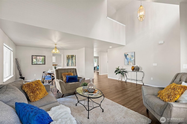 living room featuring baseboards and wood finished floors