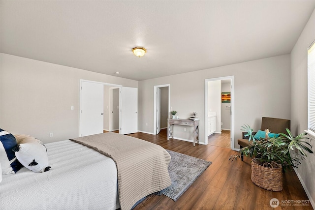 bedroom with baseboards and wood finished floors