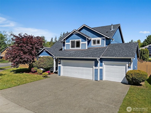 view of front of home featuring driveway, a shingled roof, a front lawn, and a garage