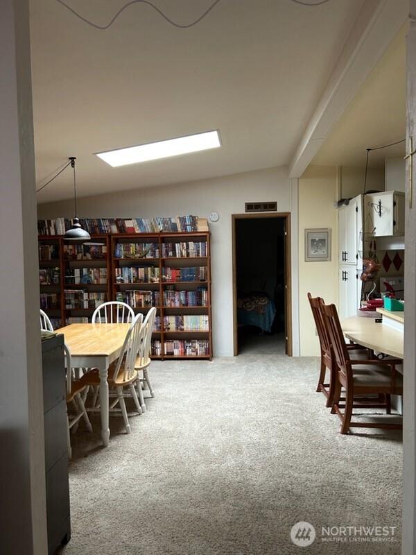 3411 28th Street Ct E Unit 81, Tacoma, WA 98443 - carpeted dining room featuring vaulted ceiling