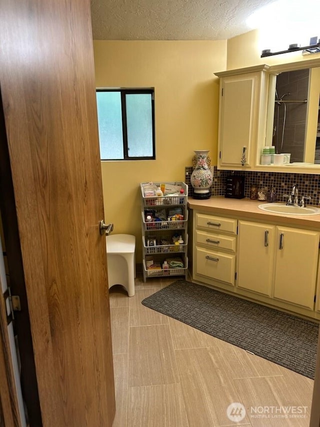 3411 28th Street Ct E Unit 81, Tacoma, WA 98443 - full bath with vanity, a textured ceiling, a shower, and tasteful backsplash