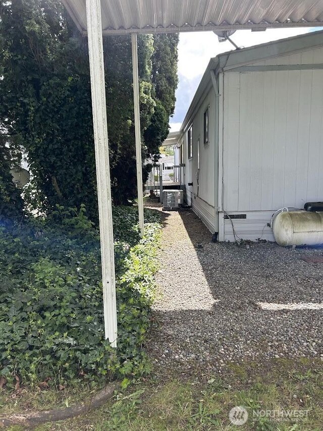 3411 28th Street Ct E Unit 81, Tacoma, WA 98443 - view of side of property with central AC and crawl space