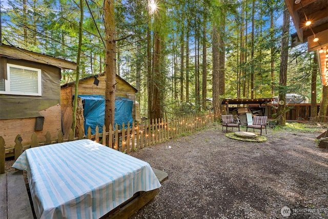 exterior space with a patio, a fenced backyard, and a jacuzzi