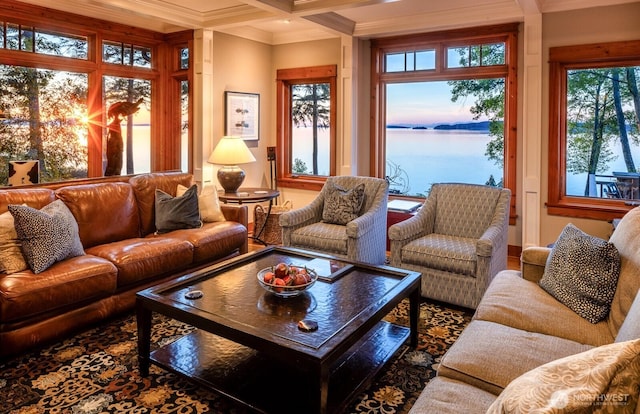 sunroom / solarium featuring beamed ceiling, a water view, and coffered ceiling