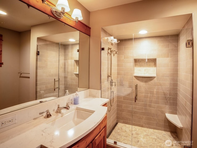 full bathroom featuring recessed lighting, a shower stall, and vanity