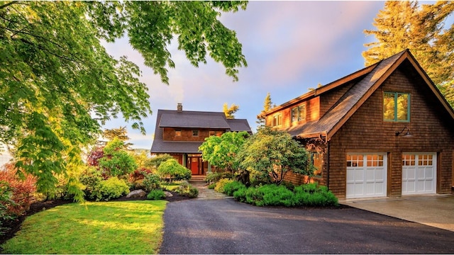 view of front of property featuring driveway and an attached garage