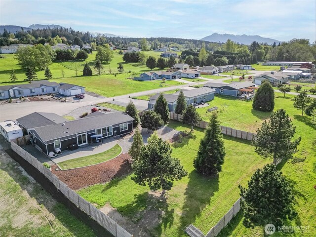birds eye view of property featuring a residential view and a mountain view