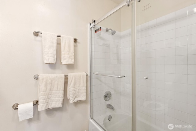 full bathroom with combined bath / shower with glass door