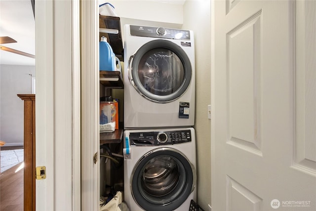 washroom with laundry area and stacked washer and dryer