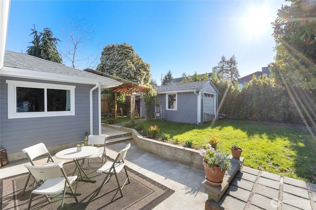 view of patio with an outbuilding and outdoor dining space