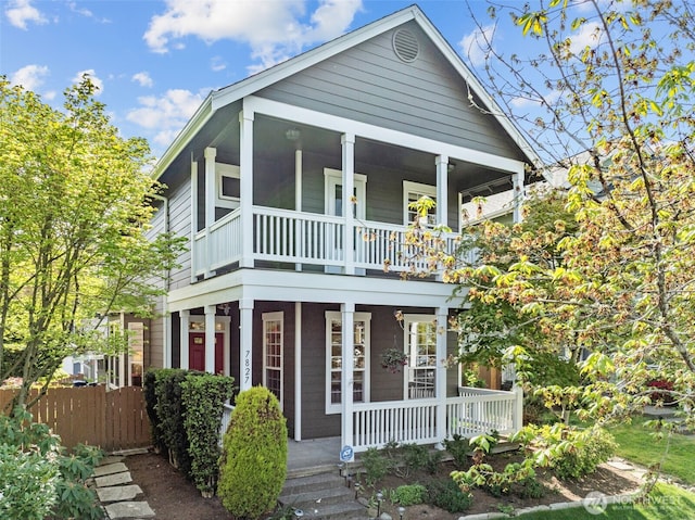 7827 Ingram Ln SE, Snoqualmie, WA 98065 - greek revival house with a balcony, fence, and covered porch