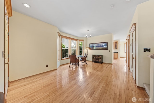 7827 Ingram Ln SE, Snoqualmie, WA 98065 - dining space featuring baseboards, a notable chandelier, and light wood-type flooring