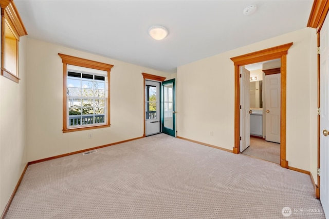 7827 Ingram Ln SE, Snoqualmie, WA 98065 - unfurnished bedroom with visible vents, baseboards, access to outside, and light colored carpet