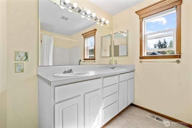 7827 Ingram Ln SE, Snoqualmie, WA 98065 - bathroom with visible vents, a wealth of natural light, and a sink