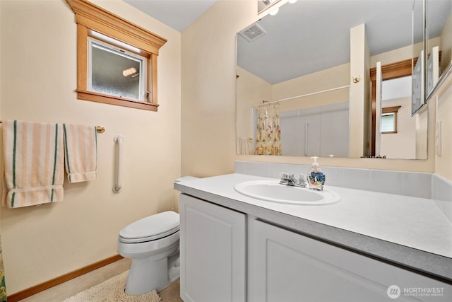 7827 Ingram Ln SE, Snoqualmie, WA 98065 - bathroom with vanity, visible vents, toilet, baseboards, and a shower with shower curtain