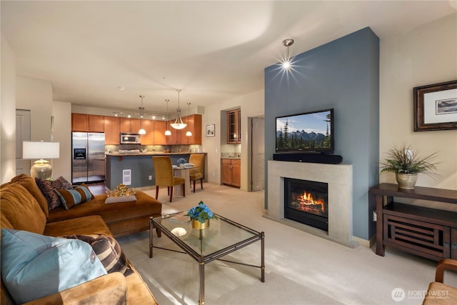 150 102nd Ave SE Unit 213, Bellevue, WA 98004 - living area with a glass covered fireplace and light carpet