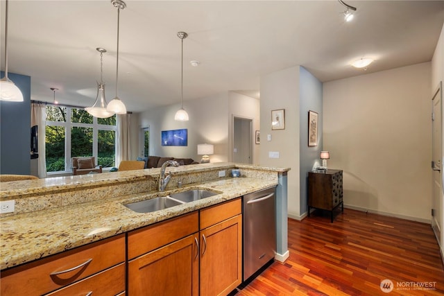 150 102nd Ave SE Unit 213, Bellevue, WA 98004 - kitchen featuring brown cabinetry, light stone countertops, wood finished floors, dishwasher, and a sink