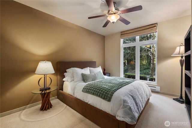 150 102nd Ave SE Unit 213, Bellevue, WA 98004 - bedroom with carpet floors, baseboards, baseboard heating, and a ceiling fan