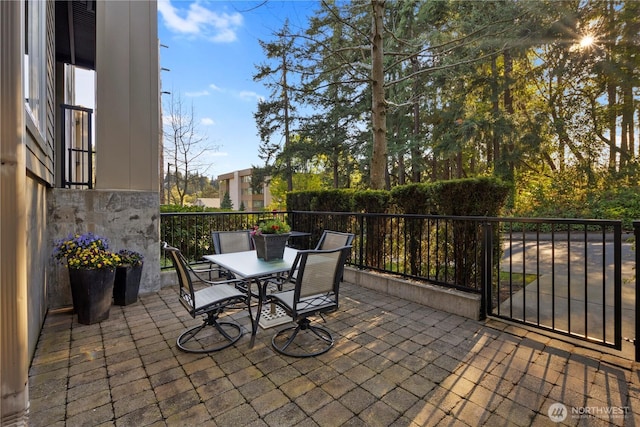 150 102nd Ave SE Unit 213, Bellevue, WA 98004 - view of patio featuring outdoor dining area