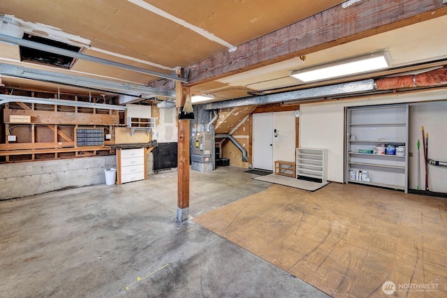 unfinished below grade area featuring heating unit
