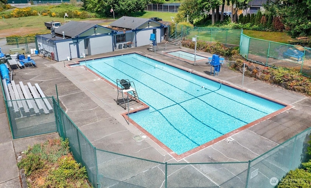 pool featuring fence and a patio