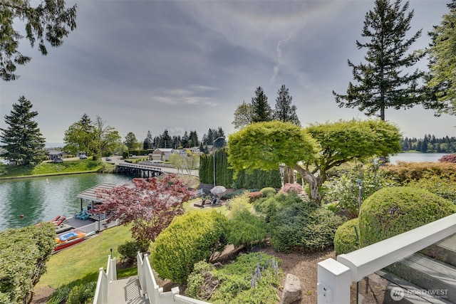 surrounding community featuring a water view