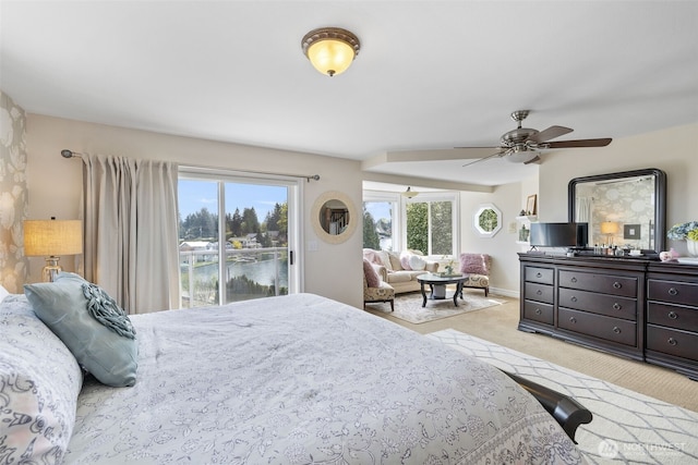 carpeted bedroom with a ceiling fan and access to exterior
