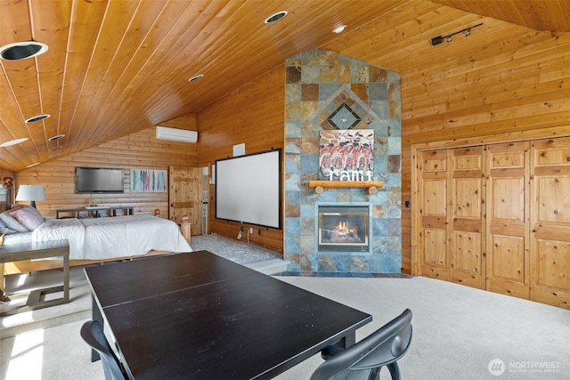 bedroom with wooden walls, a fireplace, a wall mounted air conditioner, vaulted ceiling, and wood ceiling