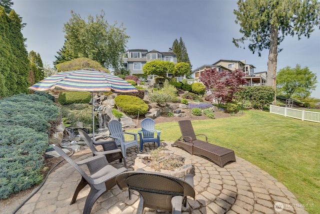 view of patio featuring fence and an outdoor fire pit