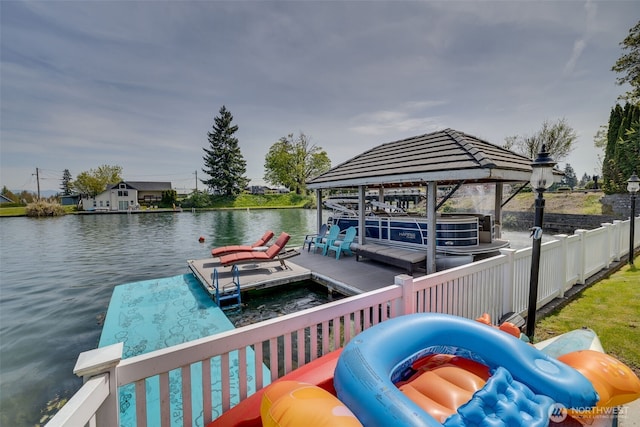 view of dock featuring a water view and fence
