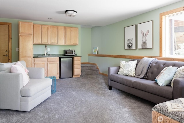living room featuring light carpet and indoor wet bar