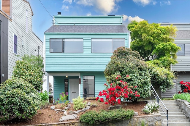 view of front of home featuring stairs