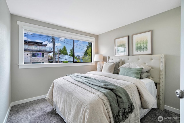 carpeted bedroom featuring baseboards