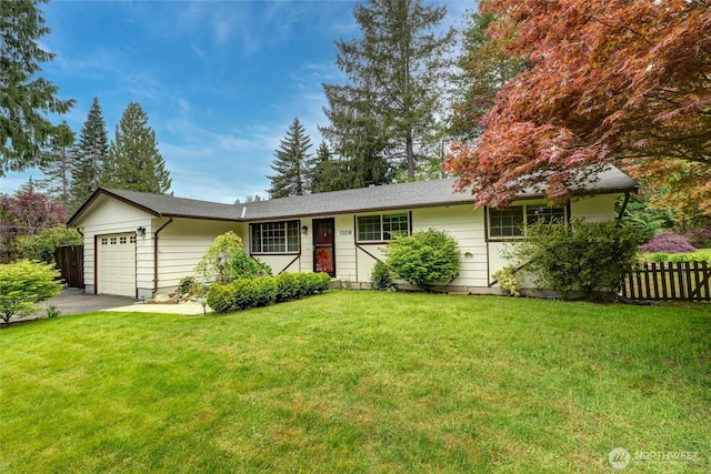 ranch-style house featuring fence, driveway, a front lawn, and a garage