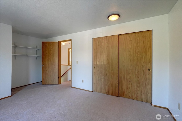 unfurnished bedroom with a closet and carpet
