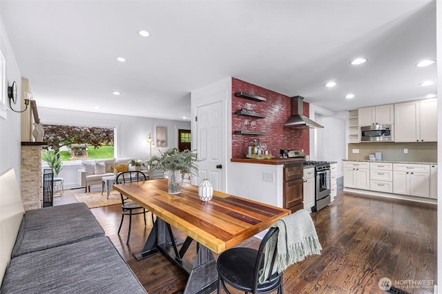 1626 106th Ave SE, Bellevue, WA 98004 - kitchen with open shelves, wall chimney exhaust hood, stainless steel appliances, and recessed lighting