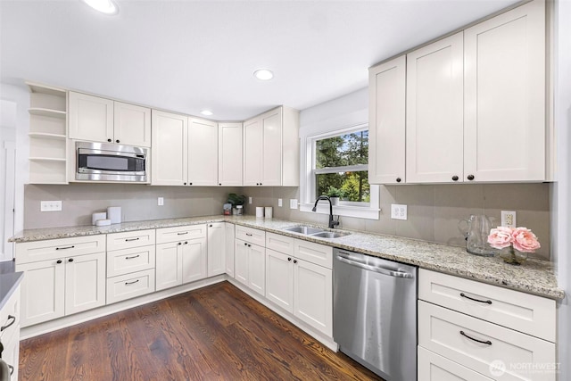 1626 106th Ave SE, Bellevue, WA 98004 - kitchen featuring recessed lighting, dark wood-style flooring, a sink, white cabinetry, and stainless steel appliances