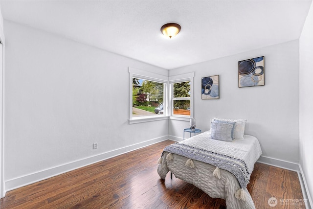 1626 106th Ave SE, Bellevue, WA 98004 - bedroom featuring baseboards and wood finished floors
